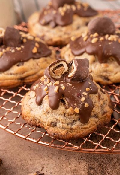 Close up of a chubby hubby cookies on a copper wire rack.