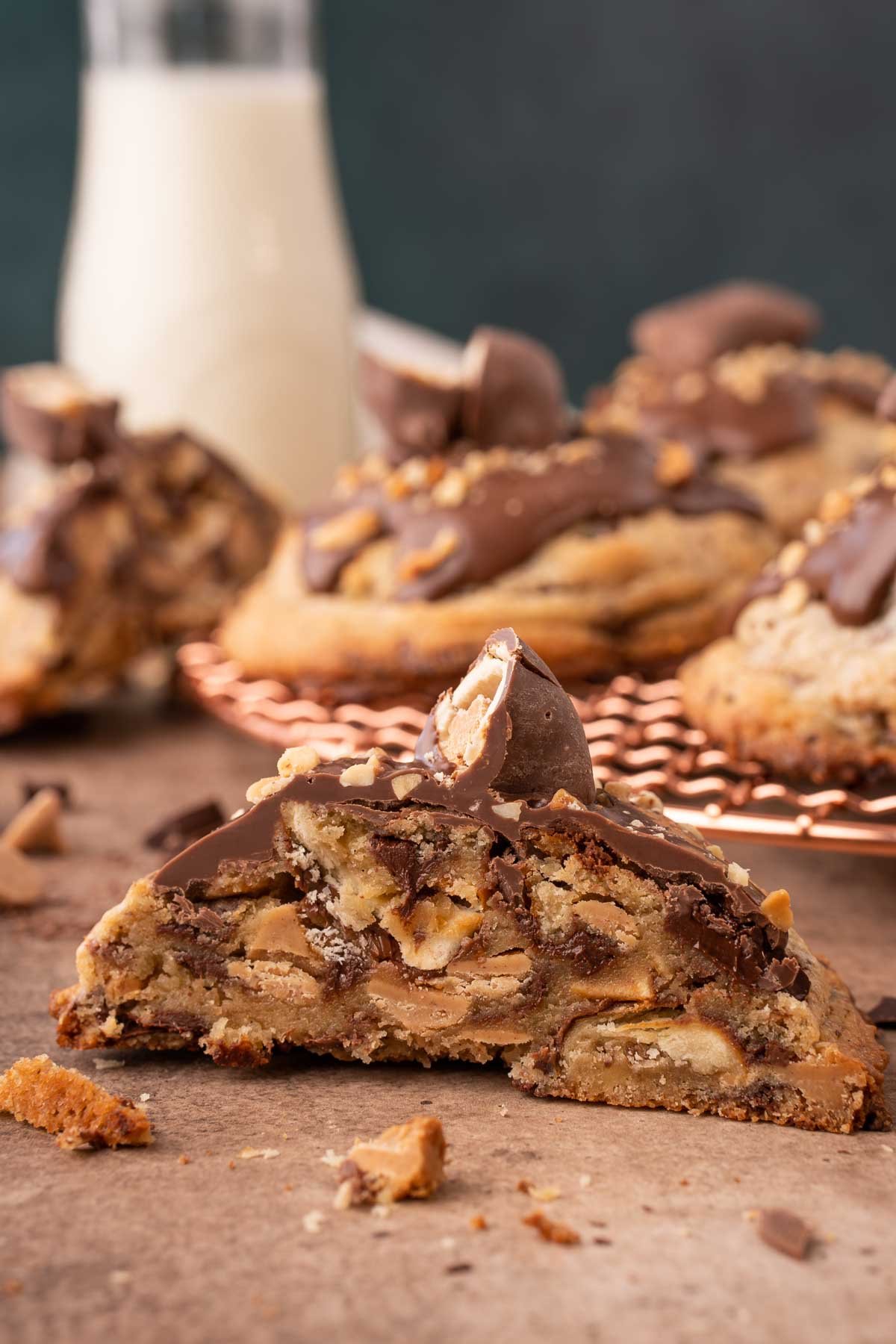 A gourmet chubby hubby cookie sliced in half to show the inside.