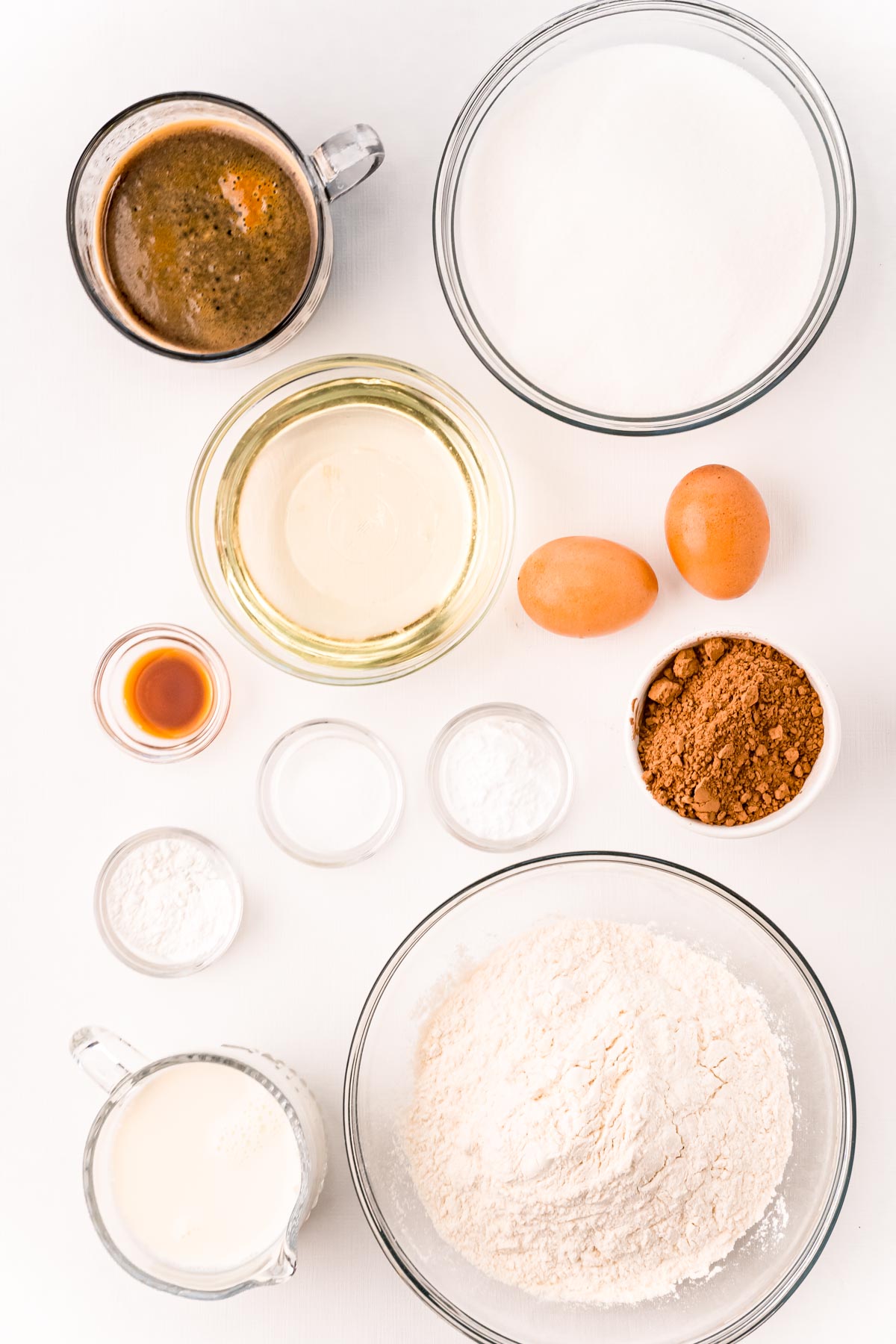 Overhead photo of ingredients prepped to make Nana's Devil's Food Cake on a white table.