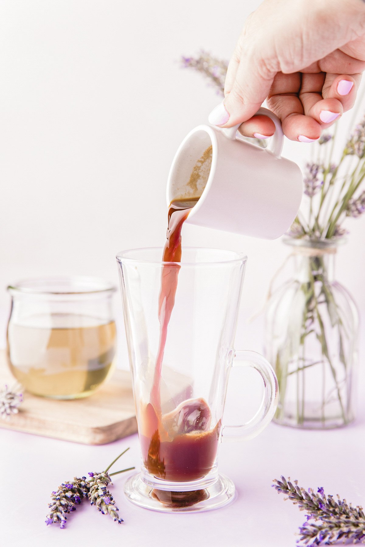 Espresso being poured into a mug.