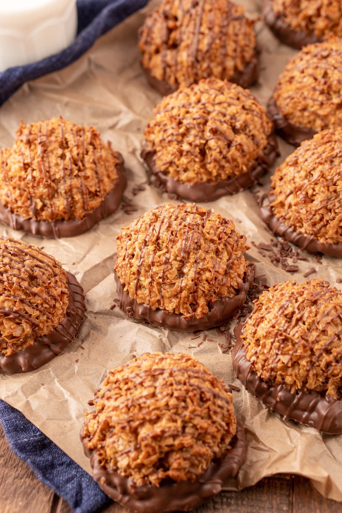 Dulce de Leche macaroons on a pieces of parchment paper.