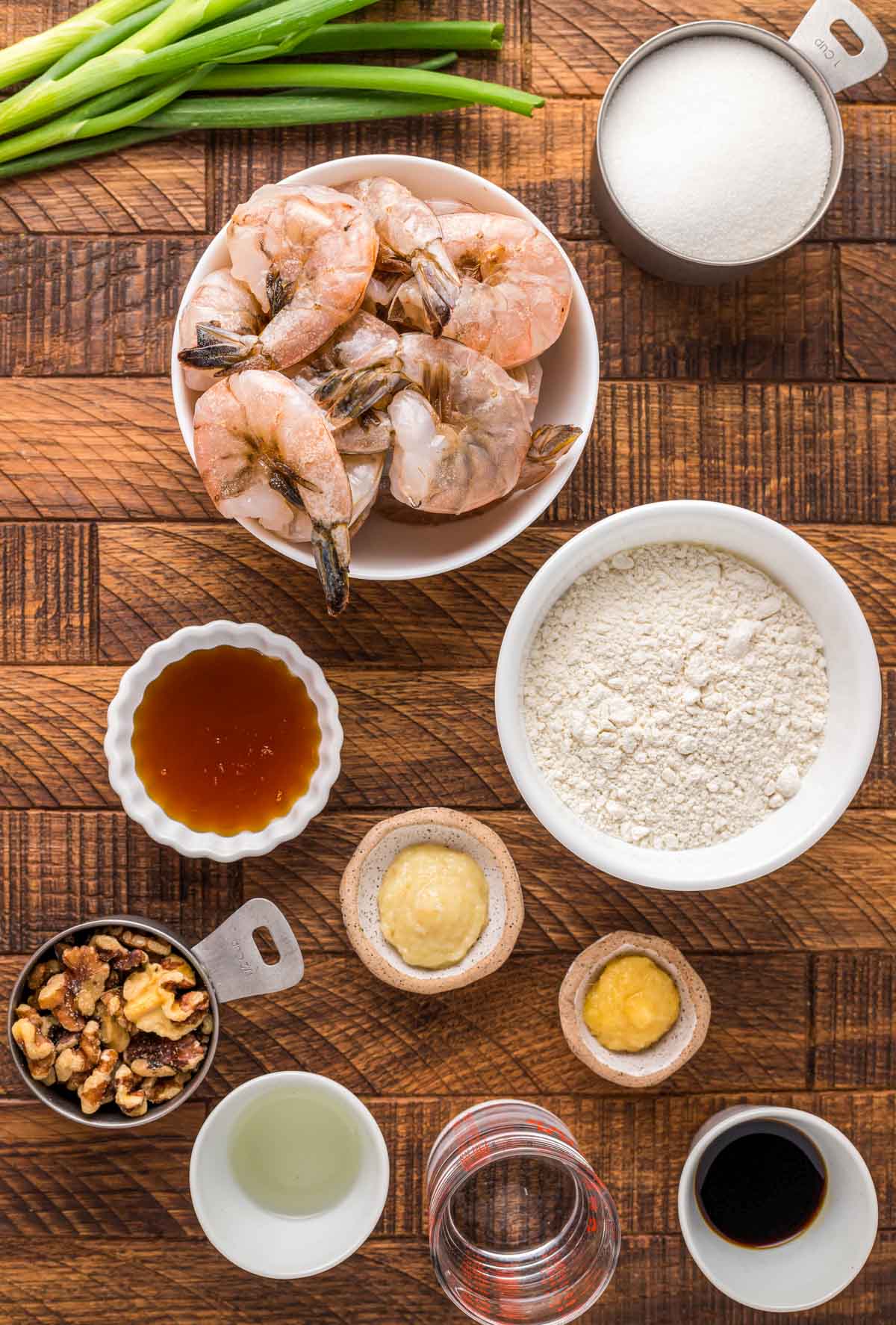 Ingredients to make Honey Walnut Shrimp on a wooden counter.