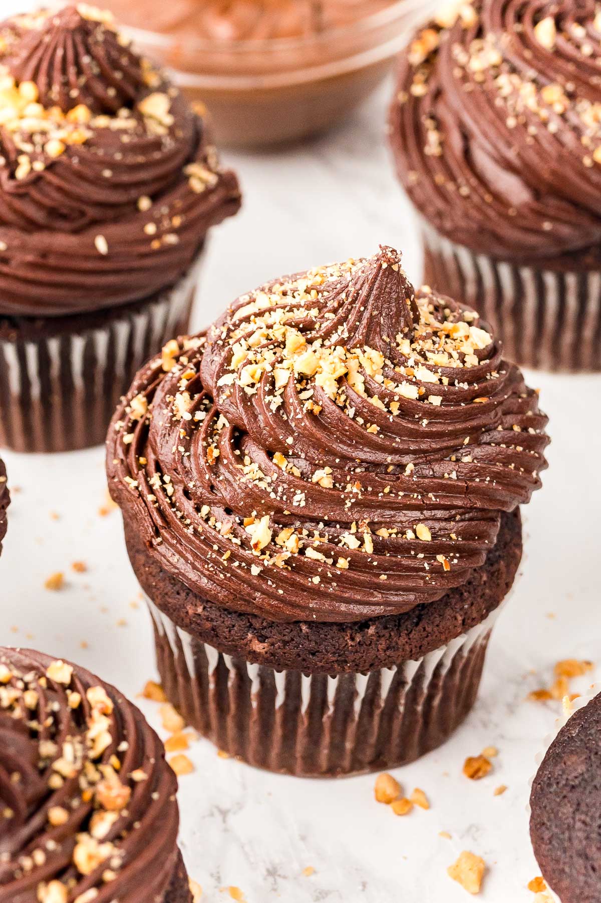 Close up of Nutella Cupcakes on a white surface.