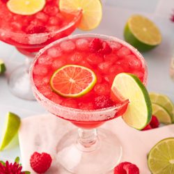 Raspberry margarita on a marble coaster.