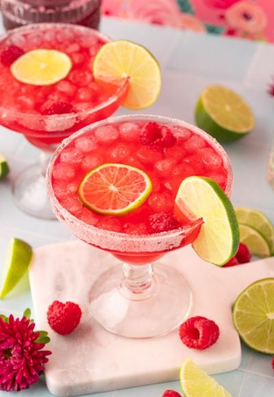 Raspberry margarita on a marble coaster.