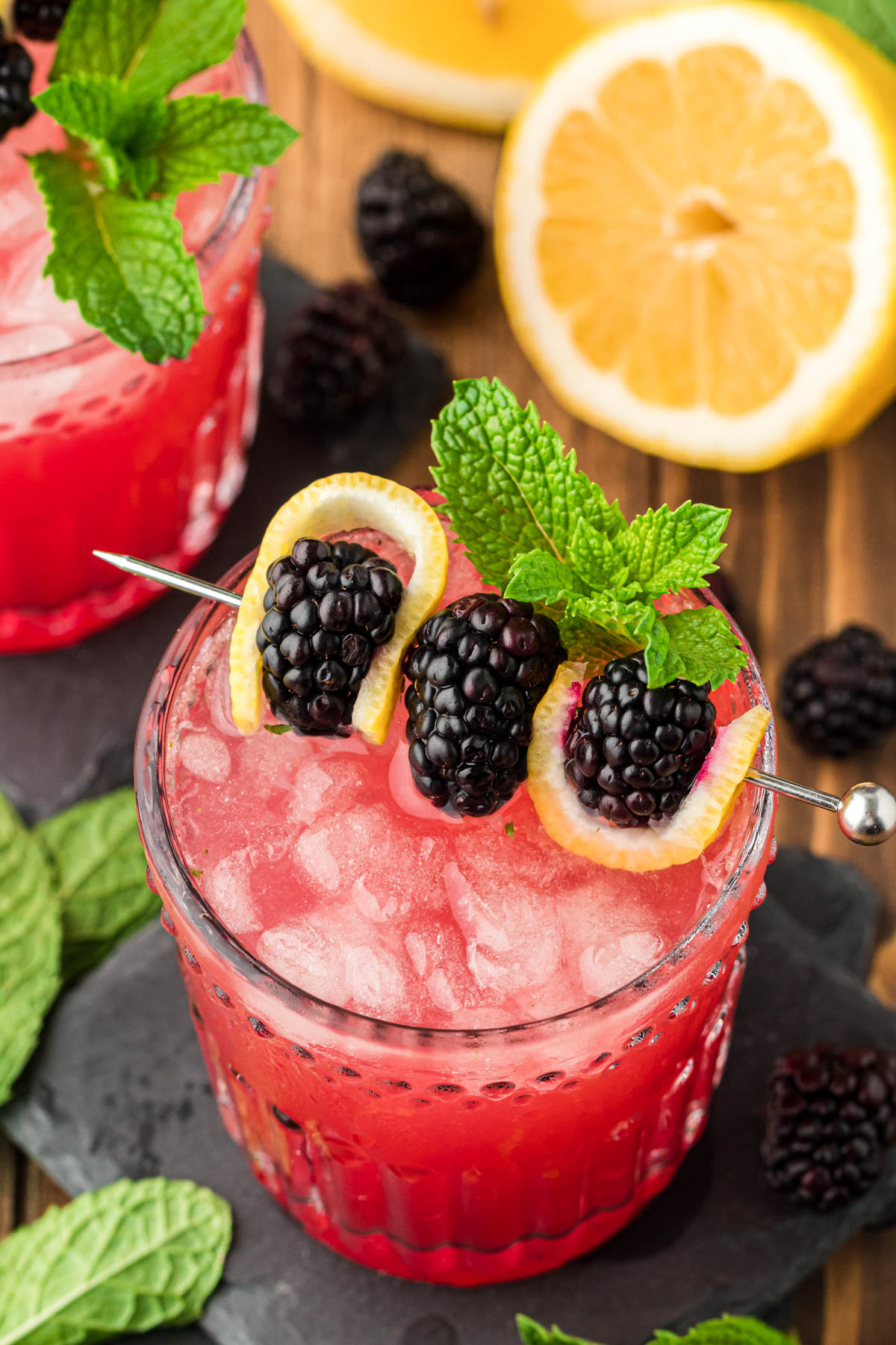 Blackberry Bourbon Smash on a slate coaster.