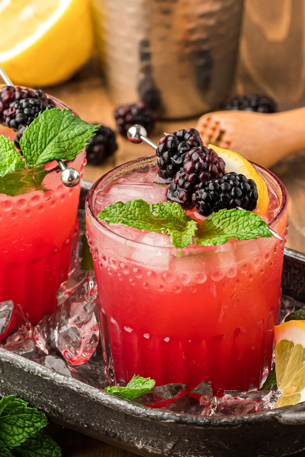 Blackberry Bourbon Smash in a black cocktail tray.