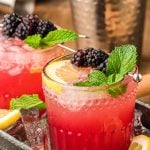 Blackberry Bourbon Smash in a black cocktail tray.