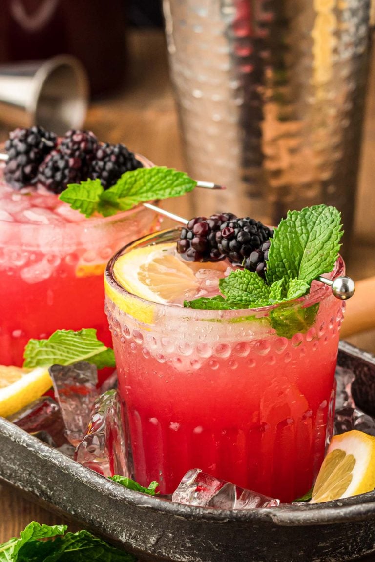 Blackberry Bourbon Smash in a black cocktail tray.