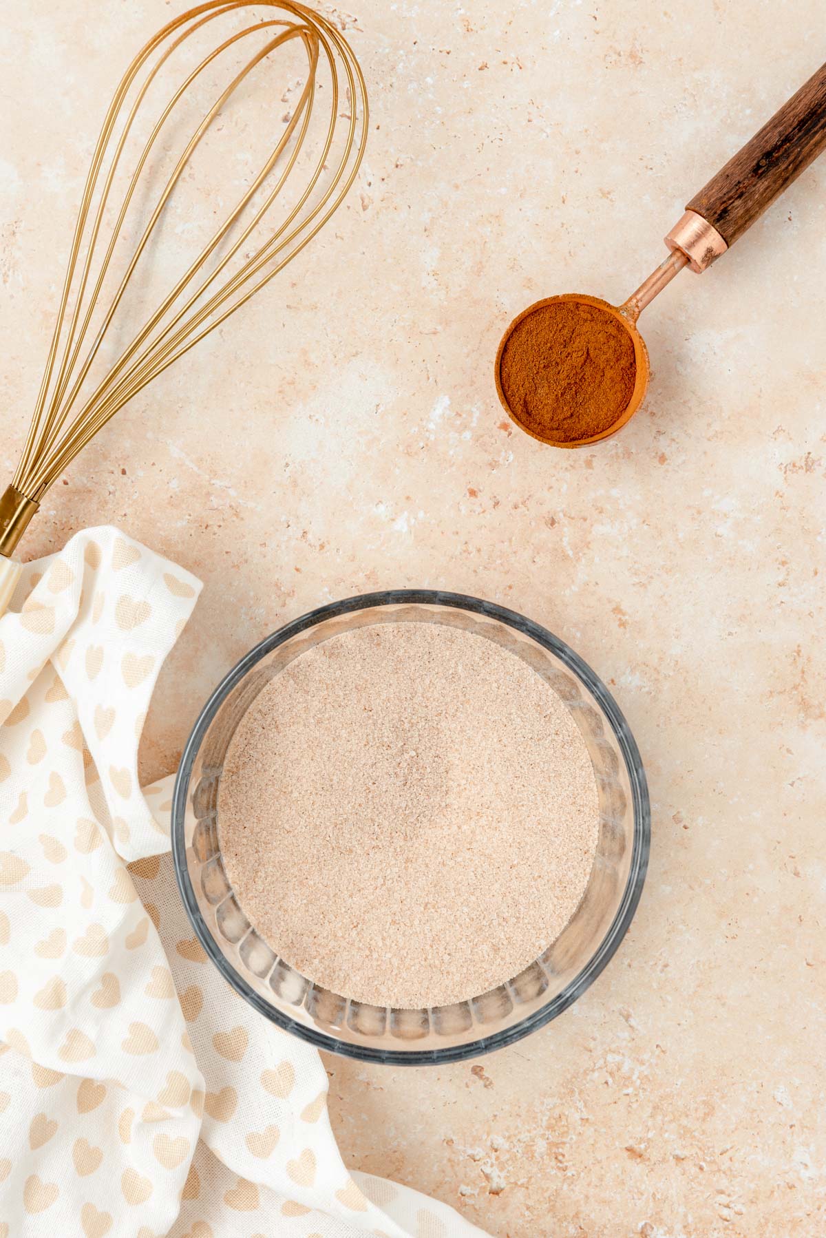 Cinnamon sugar in a glass bowl.