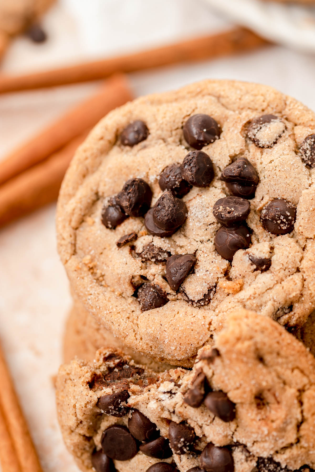 Close up of a stack of cinnamon chocolate chip cookies.