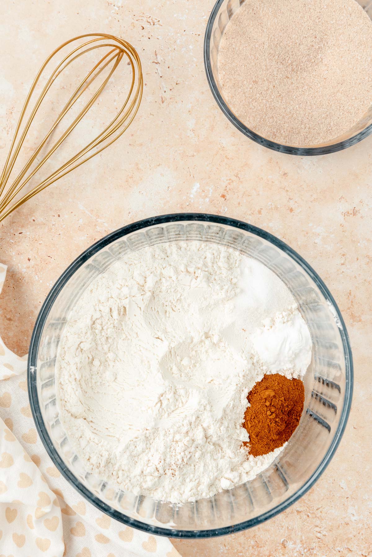 A bowl of dry ingredients to make chocolate chip cookies on a table.