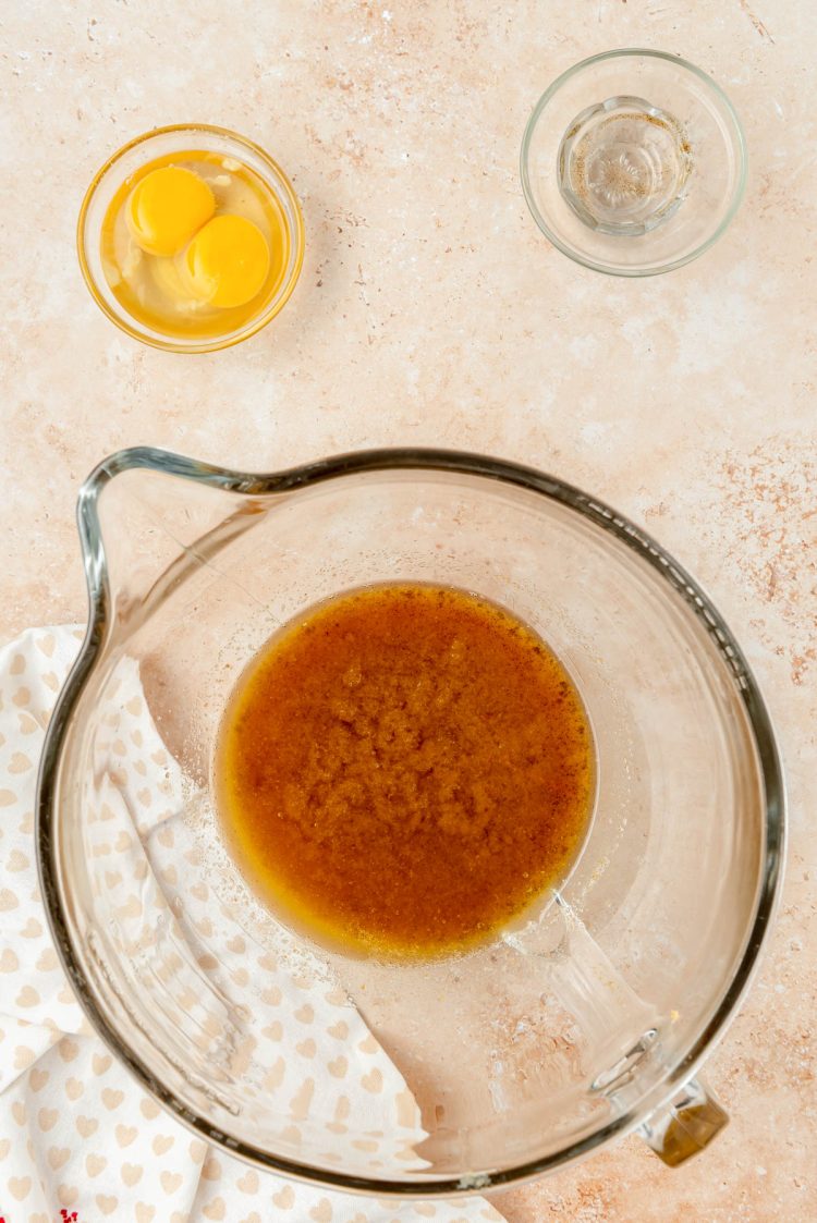 Sugar and browned butter in a mixing bowl.