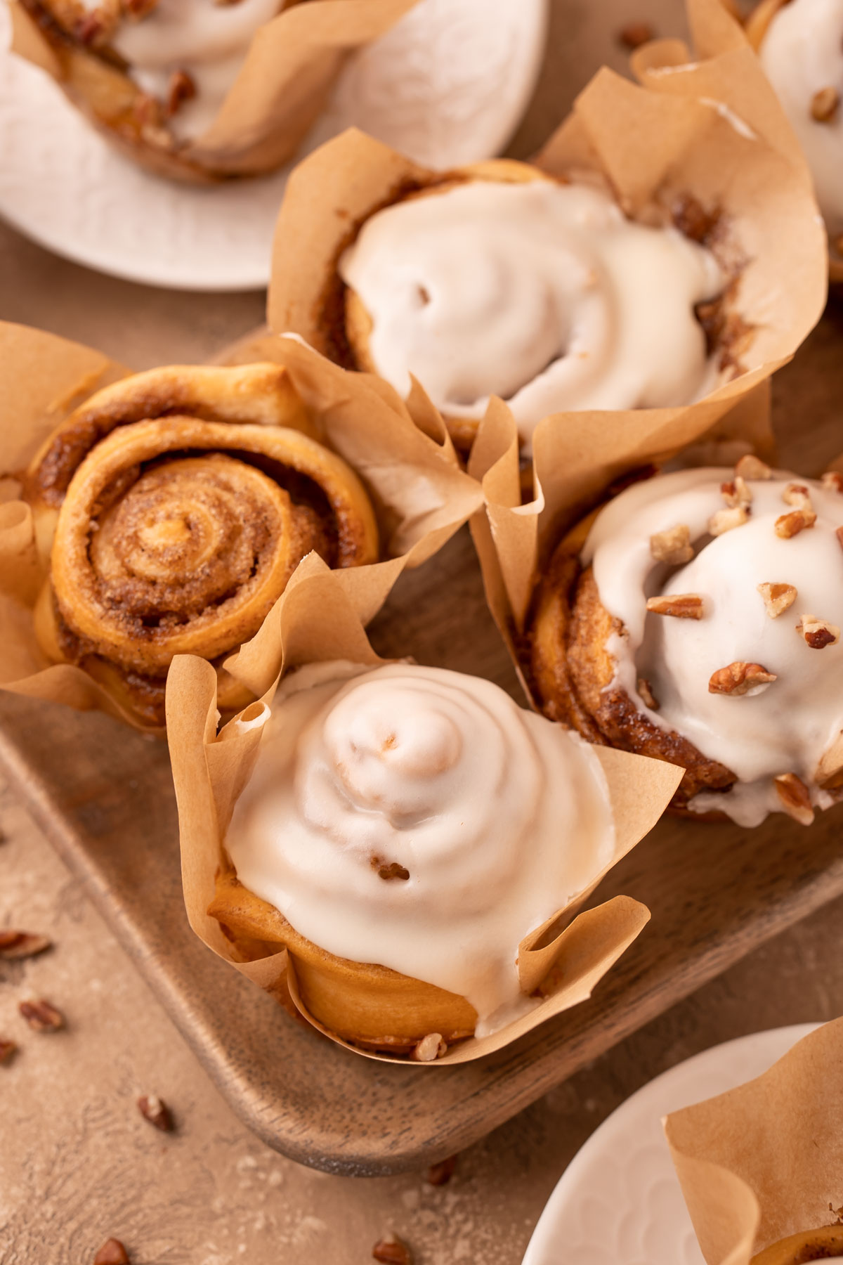 Mini Pecan Rolls on a wooden tray.