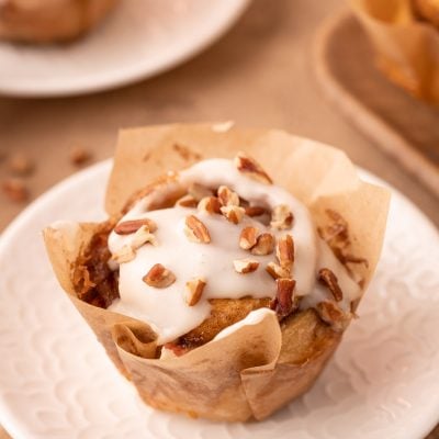 Easy Pecan Roll in a pastry lined on a white plate.