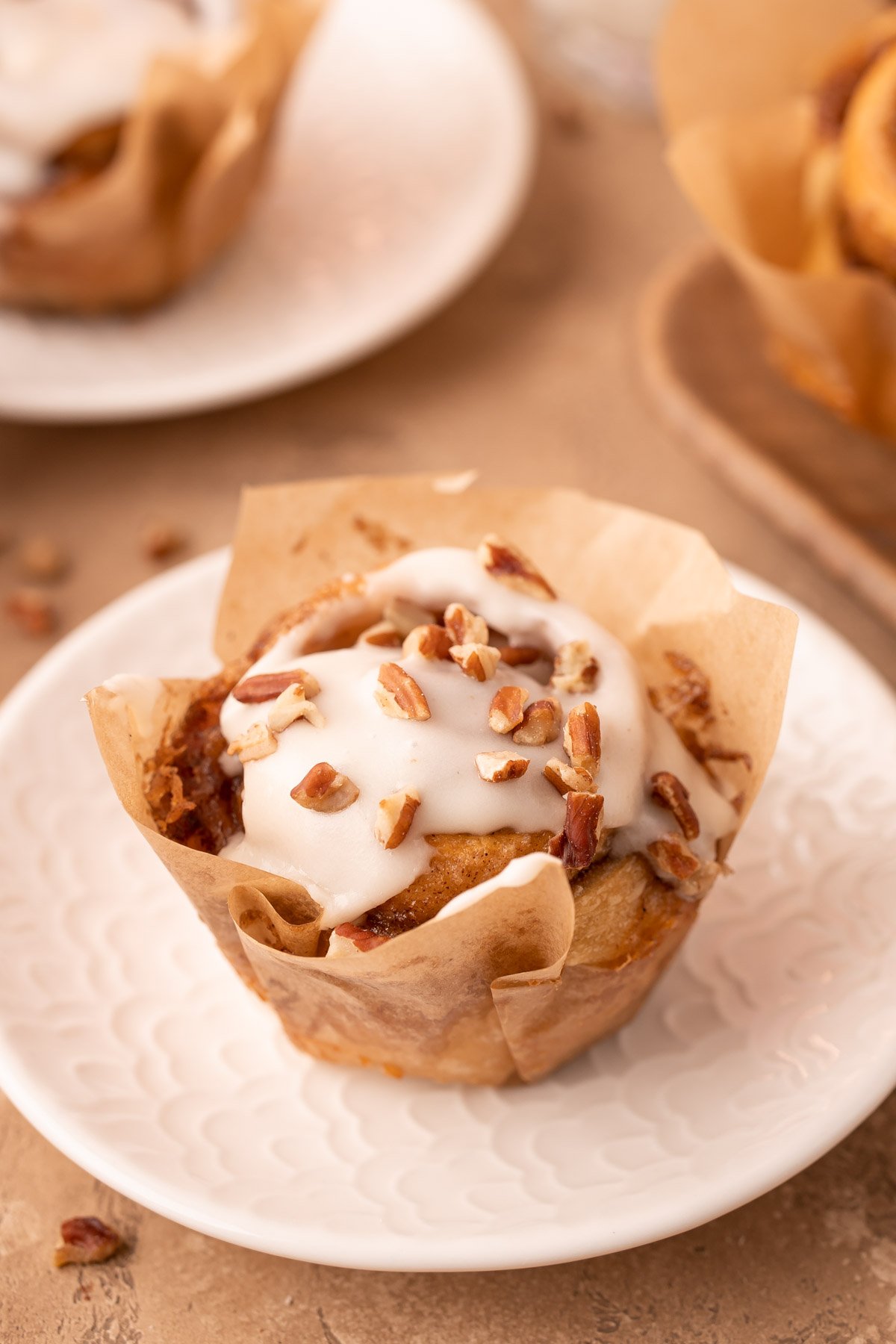 Easy Pecan Roll in a pastry lined on a white plate.