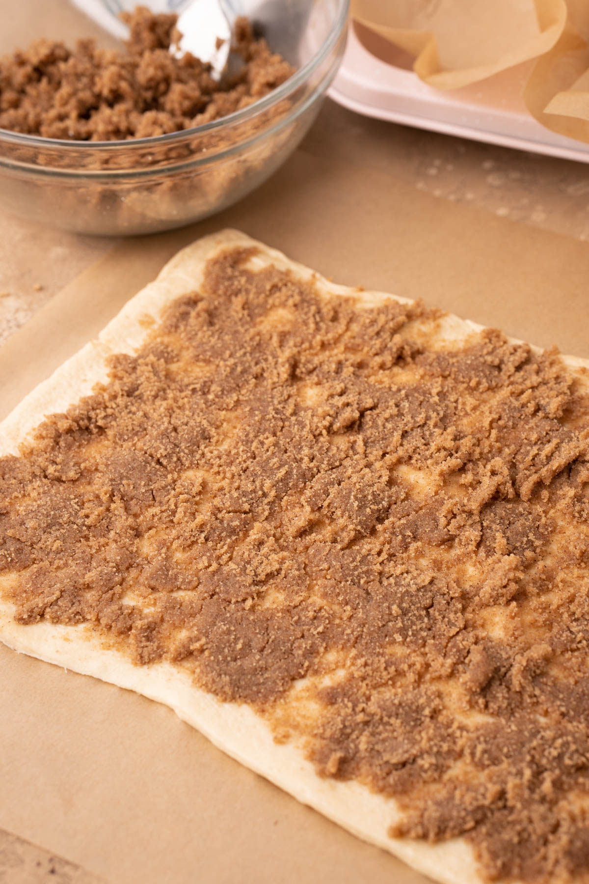 Crescent roll dough covered in brown sugar cinnamon mixture.