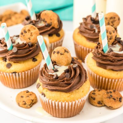 Milk and Cookies cupcakes on a white cake stand.