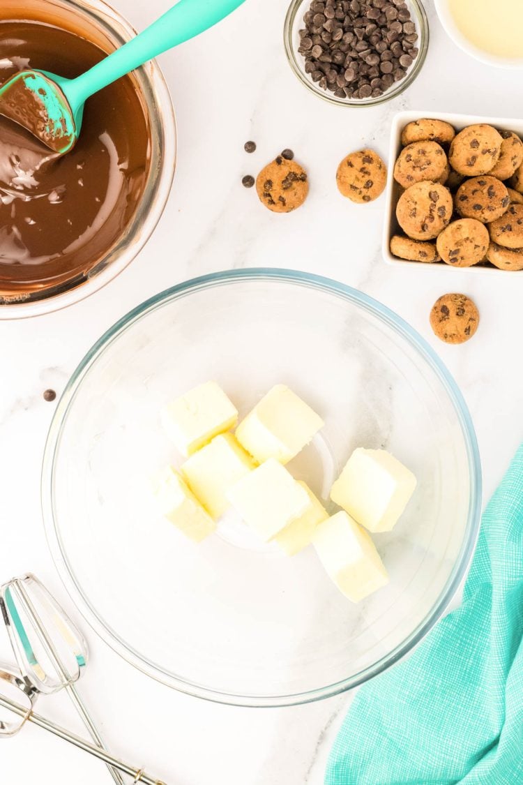 Butter cut up in a mixing bowl.