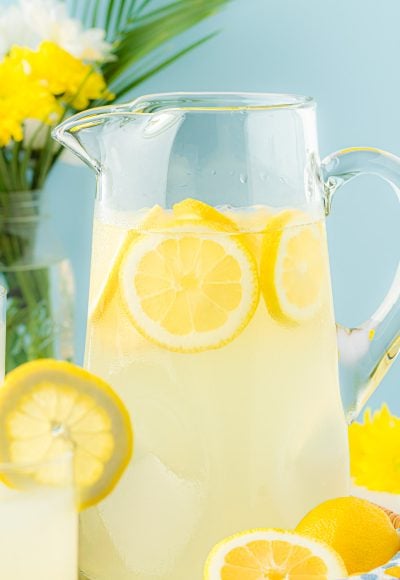 A large pitcher filled with lemonade.