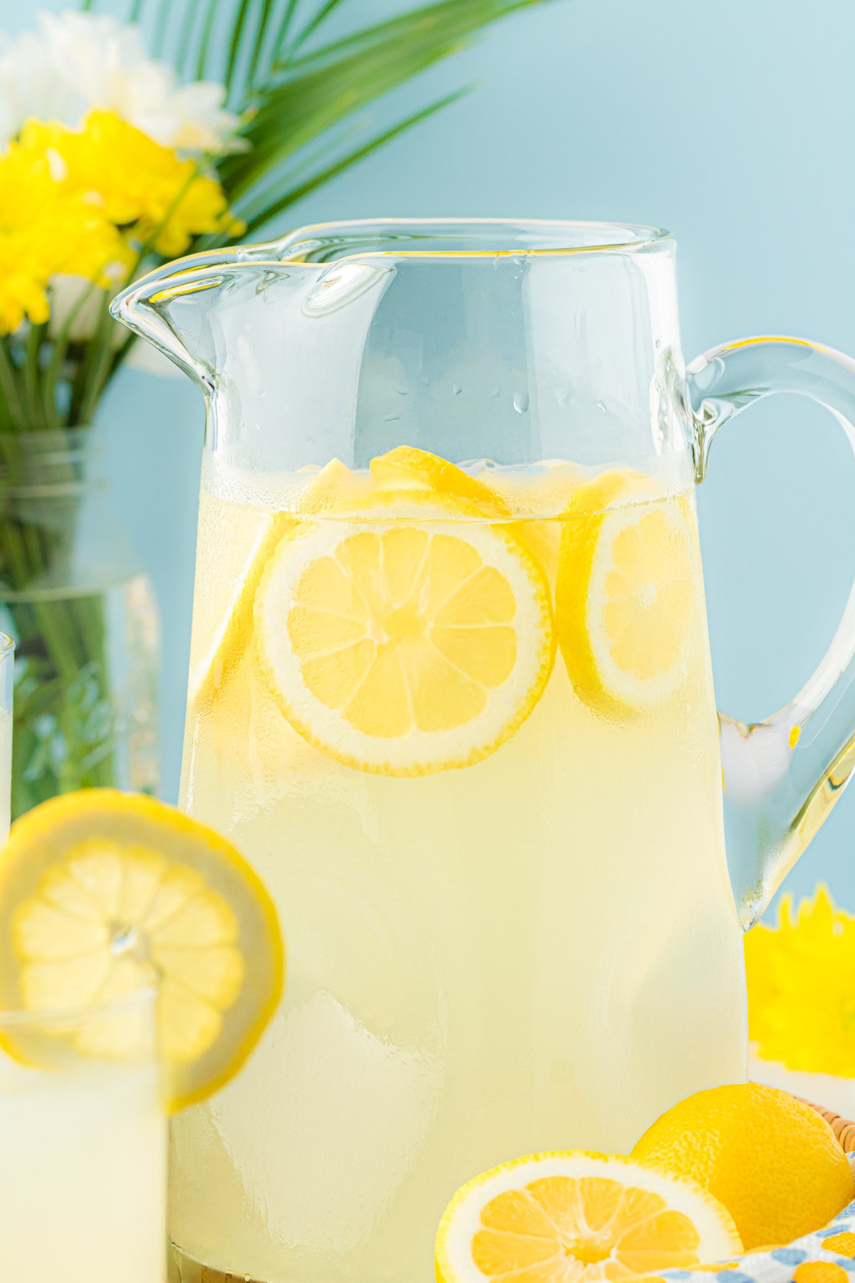 A large pitcher filled with lemonade.