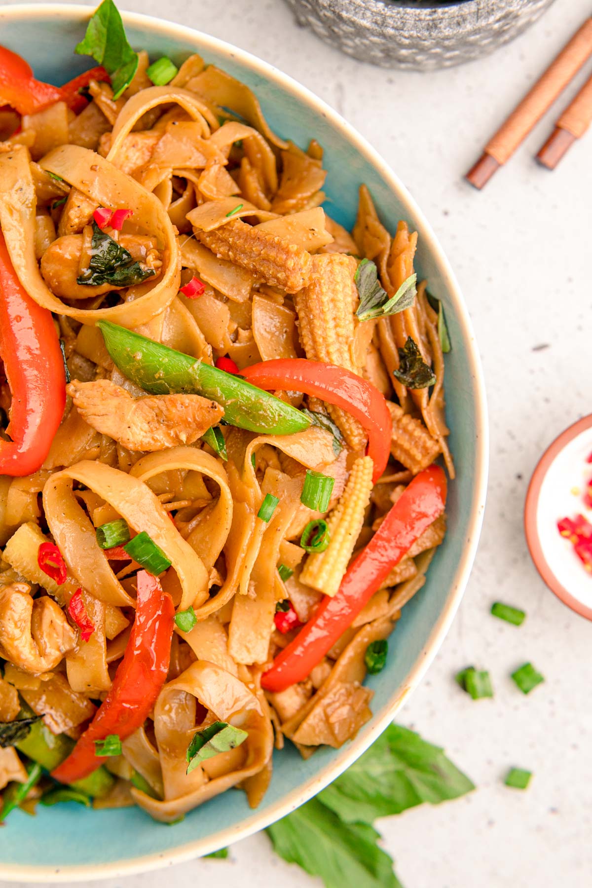 Thai Drunken Noodles in a blue bowl.