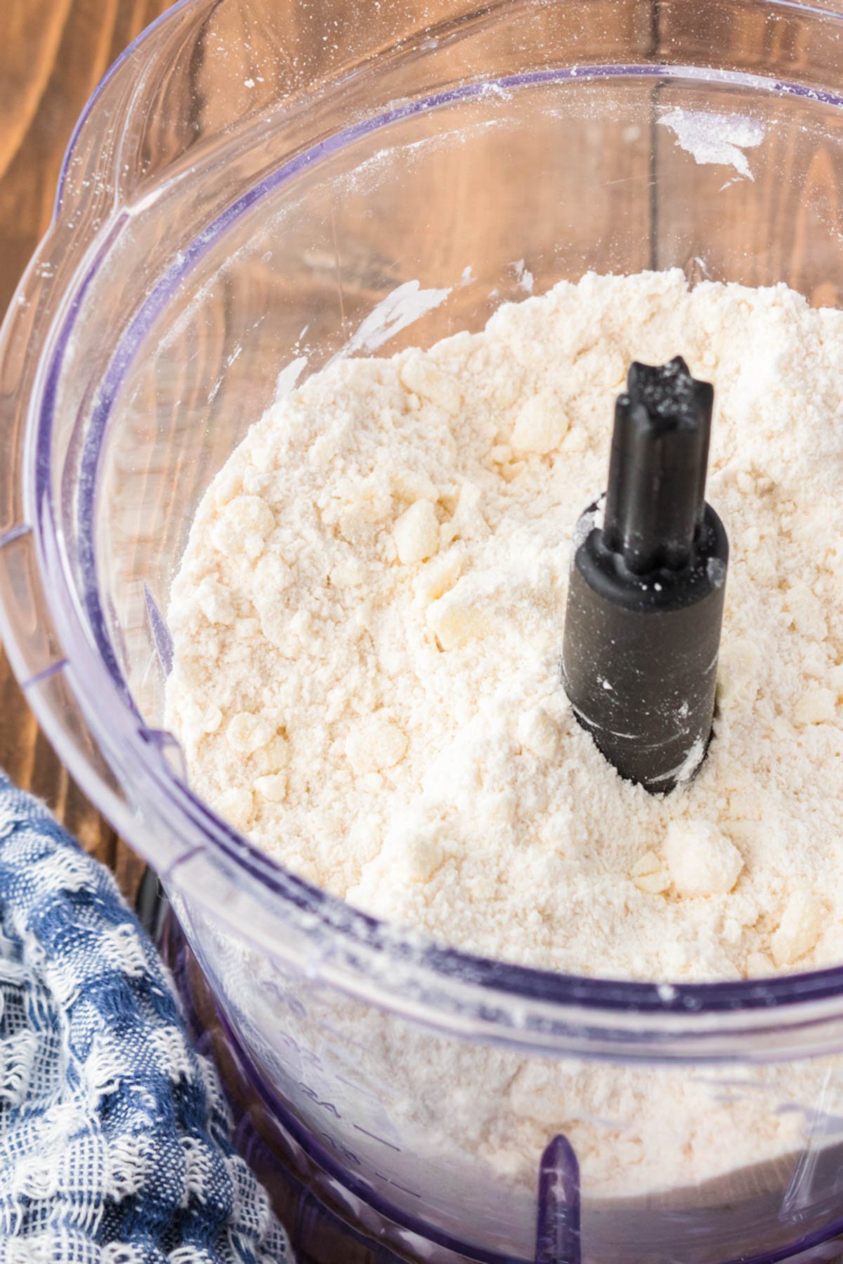 Flour and butter and sugar in a food processor.