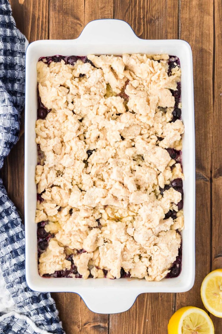 Overhead photo of blueberry cobbler getting ready to go in the oven.