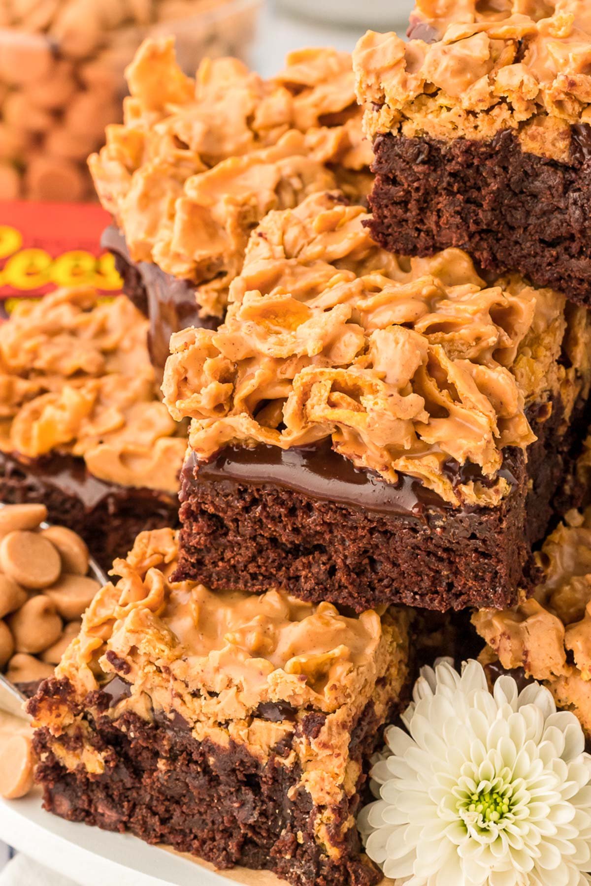 Peanut butter cornflake brownies piled on a plate.