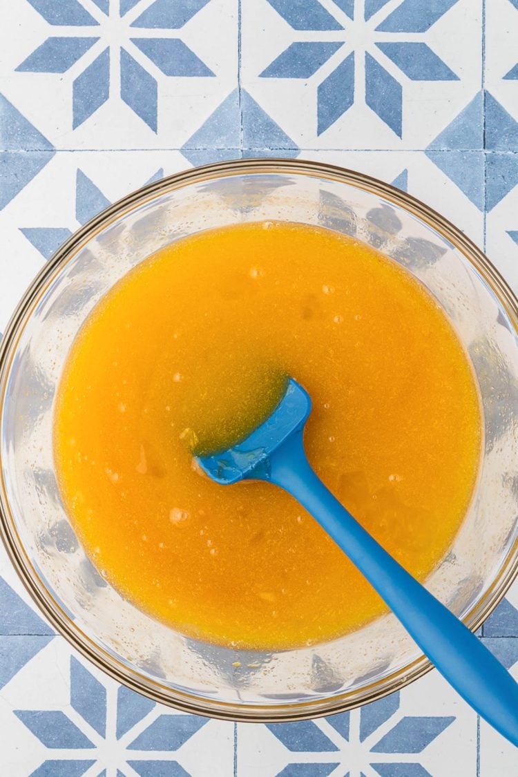 Egg and sugar mixture in a bowl to make brownies.