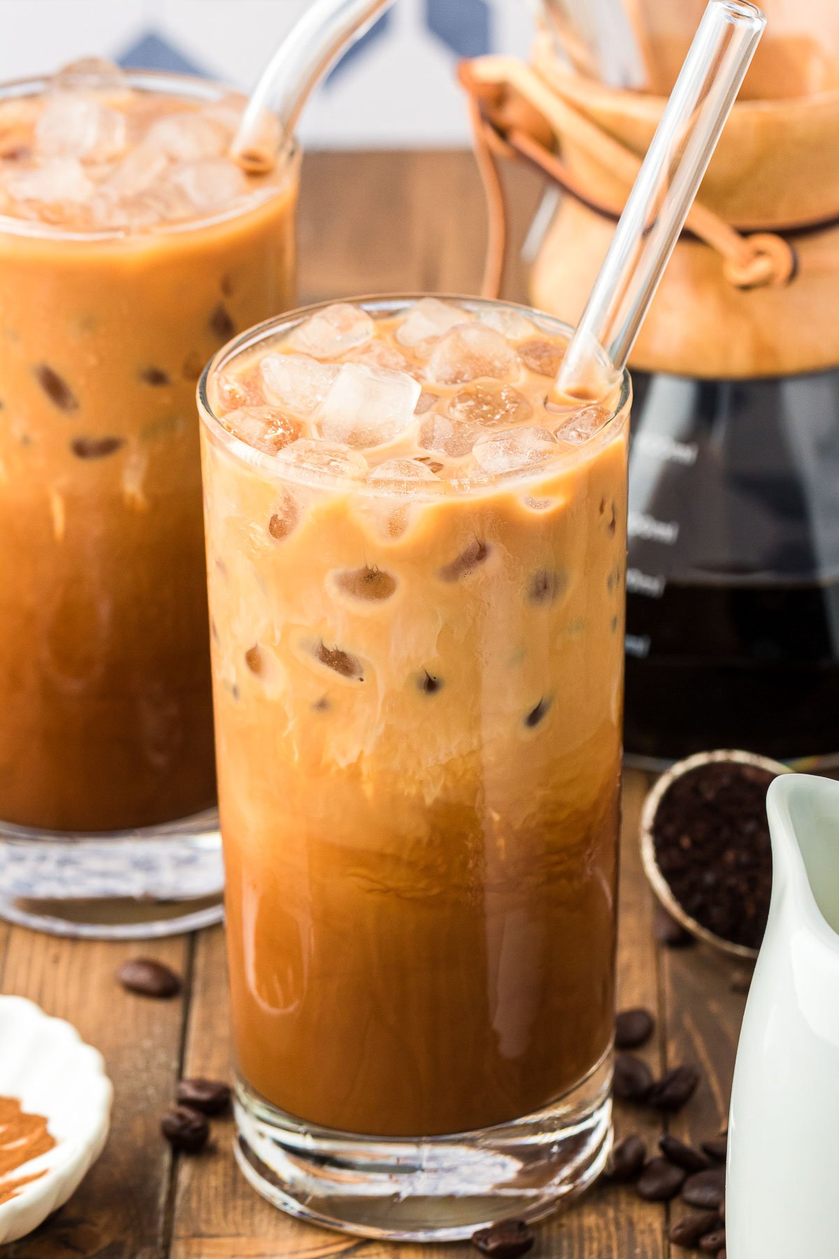 Glasses of Thai iced coffee on a wooden table.