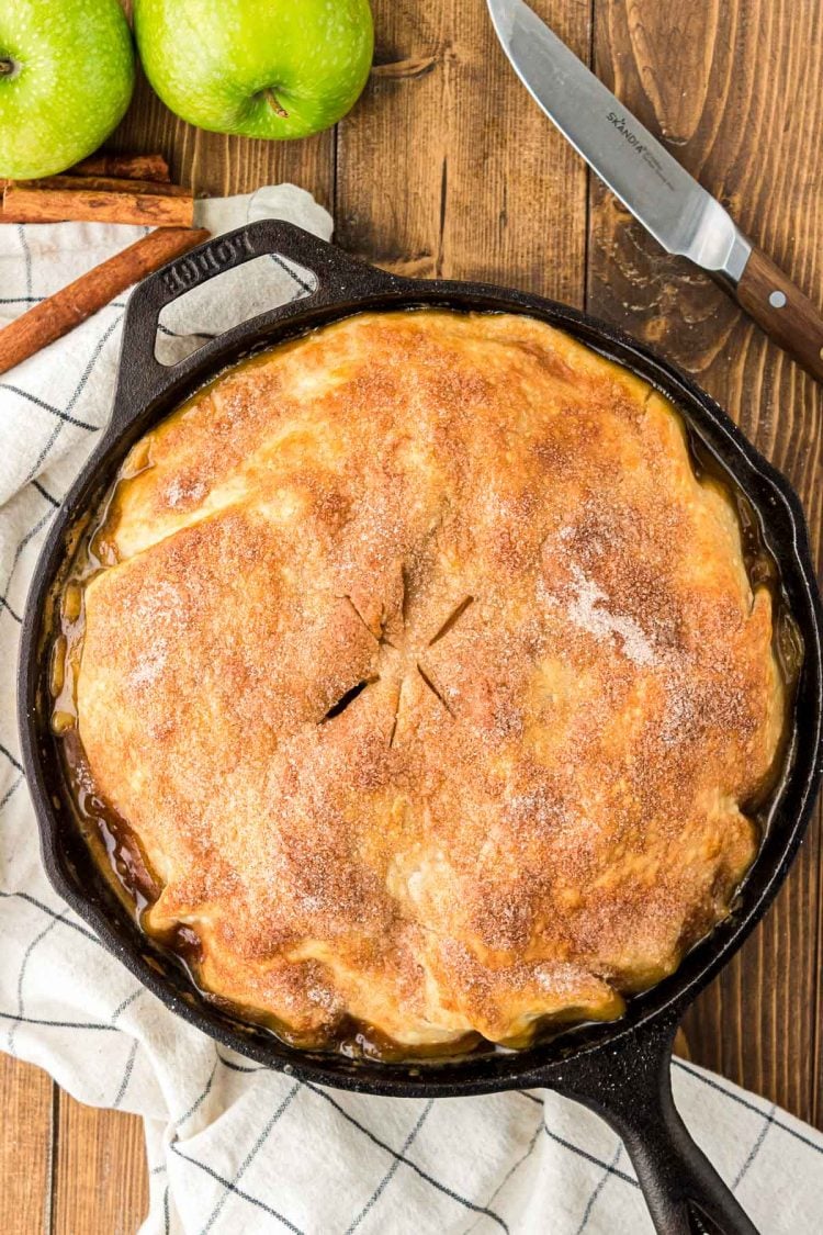 A baked apple pandowdy in a skillet.