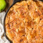 Overhead photo of a cast iron skillet filled with apple pandowdy.