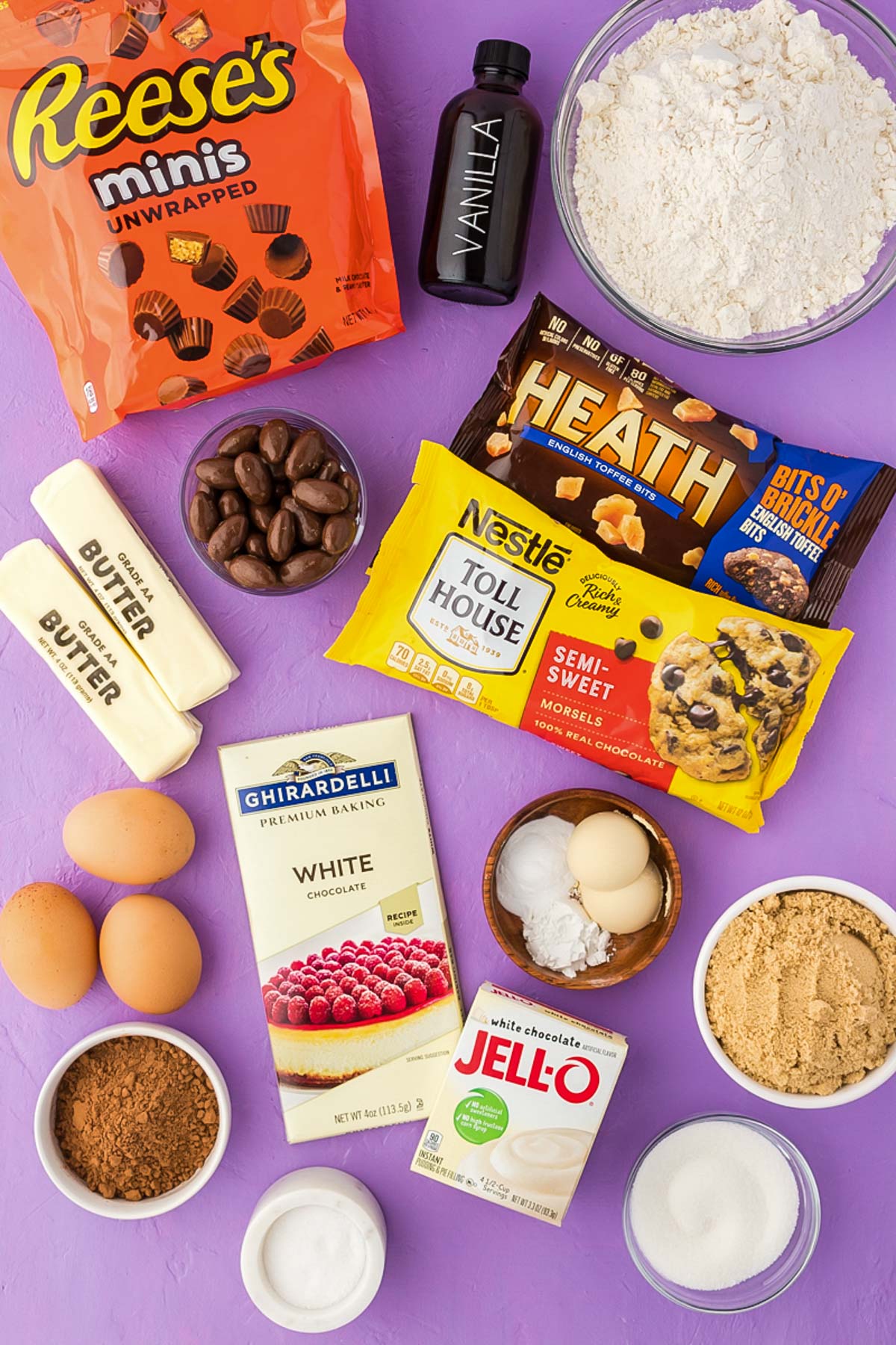 Overhead photo of kitchen sink cookie ingredients on a purple surface.