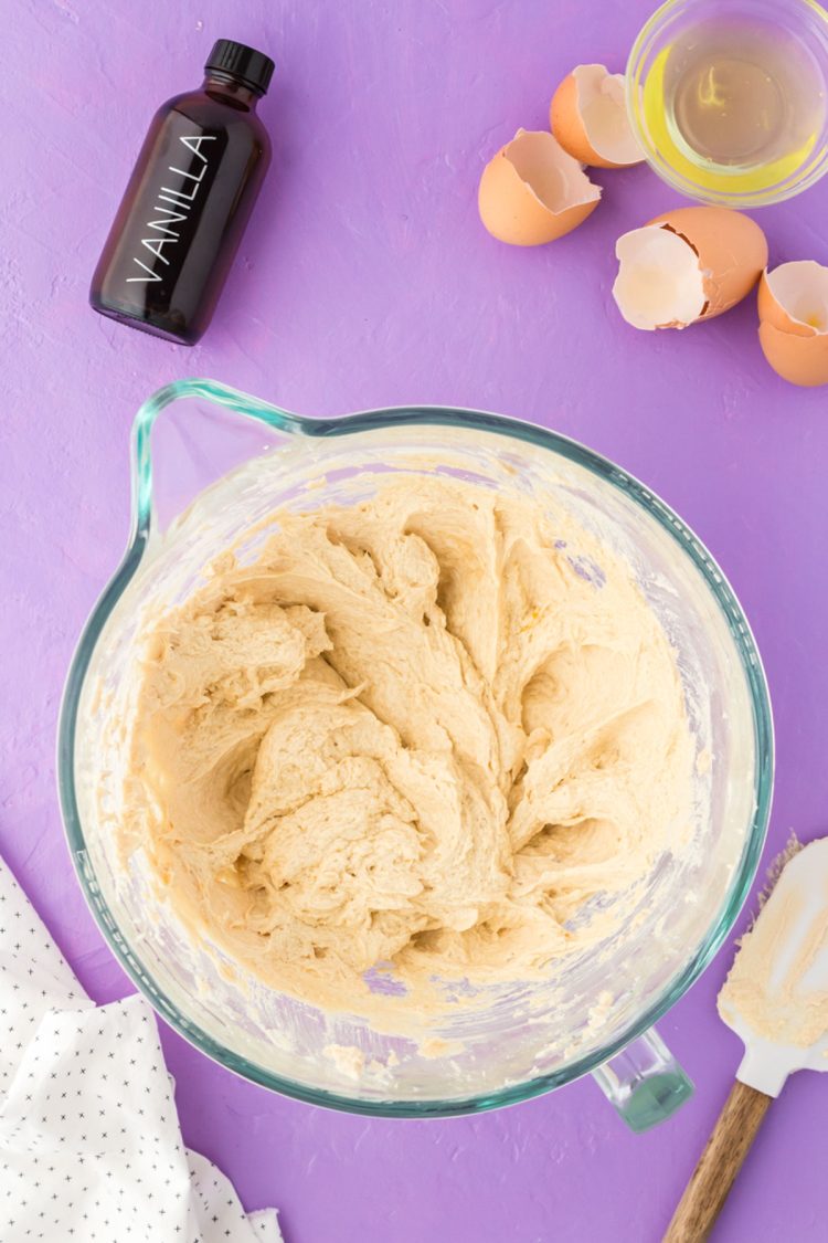 The beginning of cookies dough being made in a glass bowl.