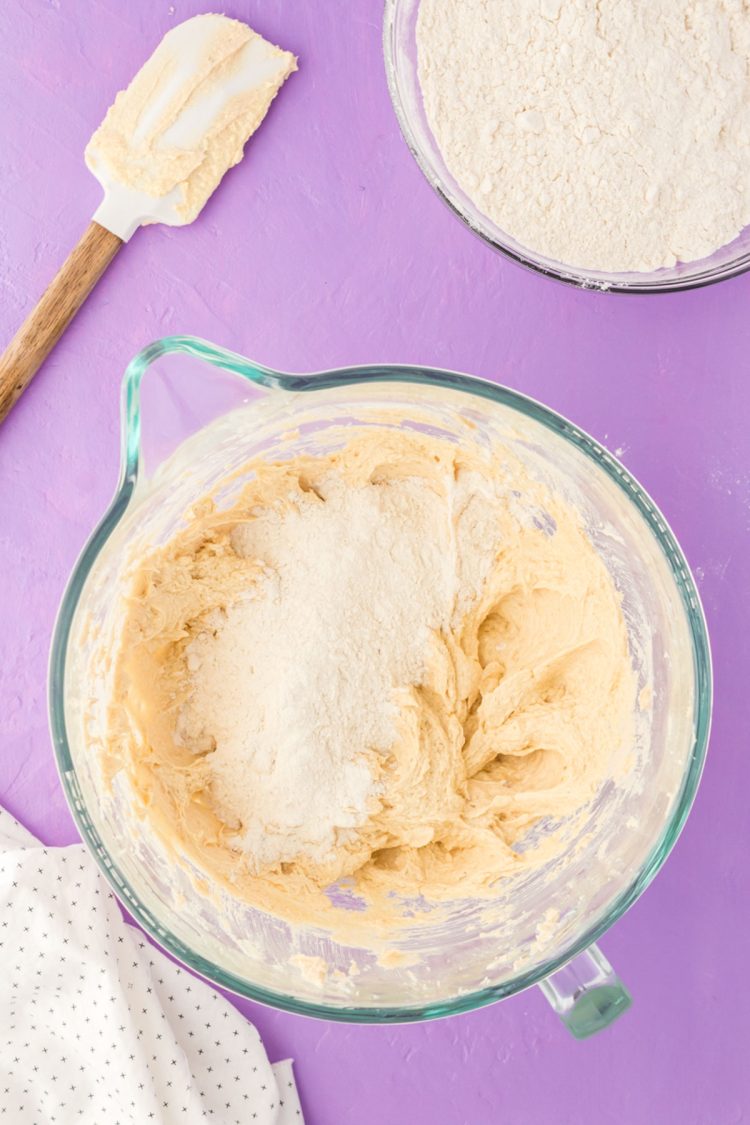 Dry ingredients being added to cookie dough.