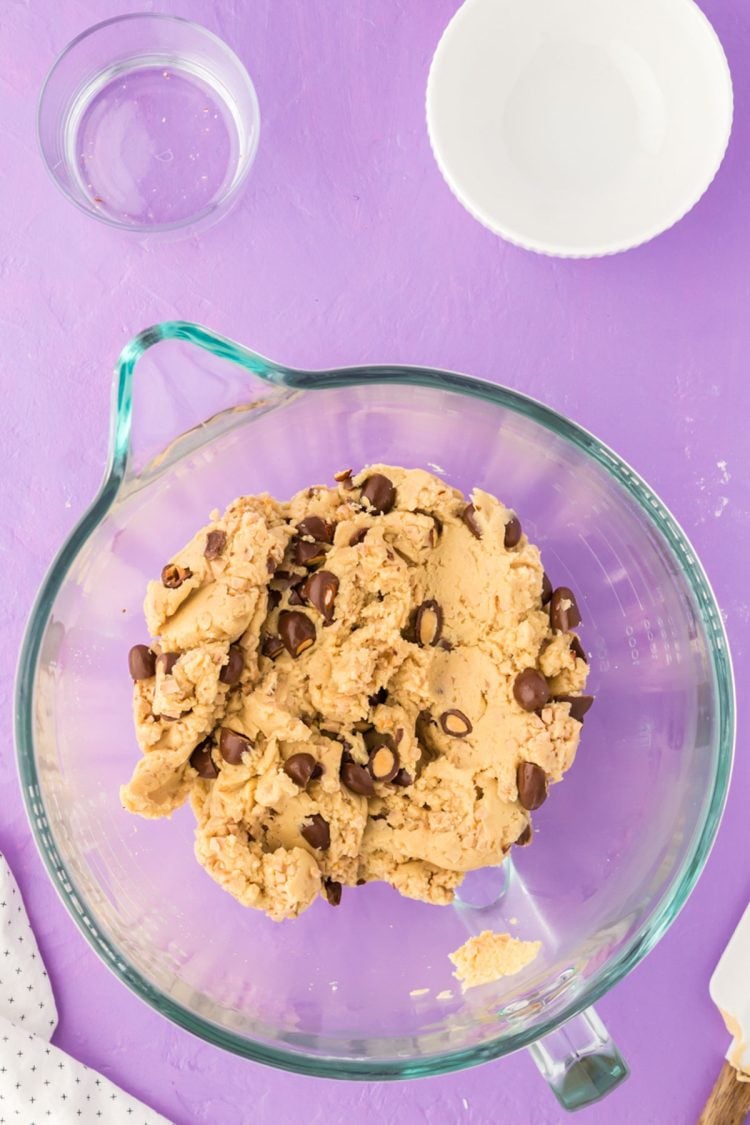 Vanilla cookie dough with chocolate covered almonds and toffee bits in it.