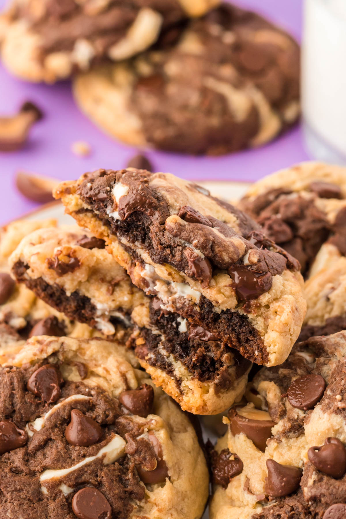 Everything but the kitchen sink cookies piled on a plate.