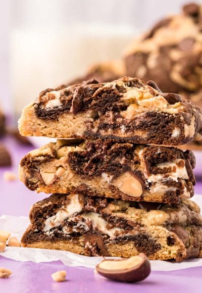 A stack of three kitchen sink cookies that have been cut in half.