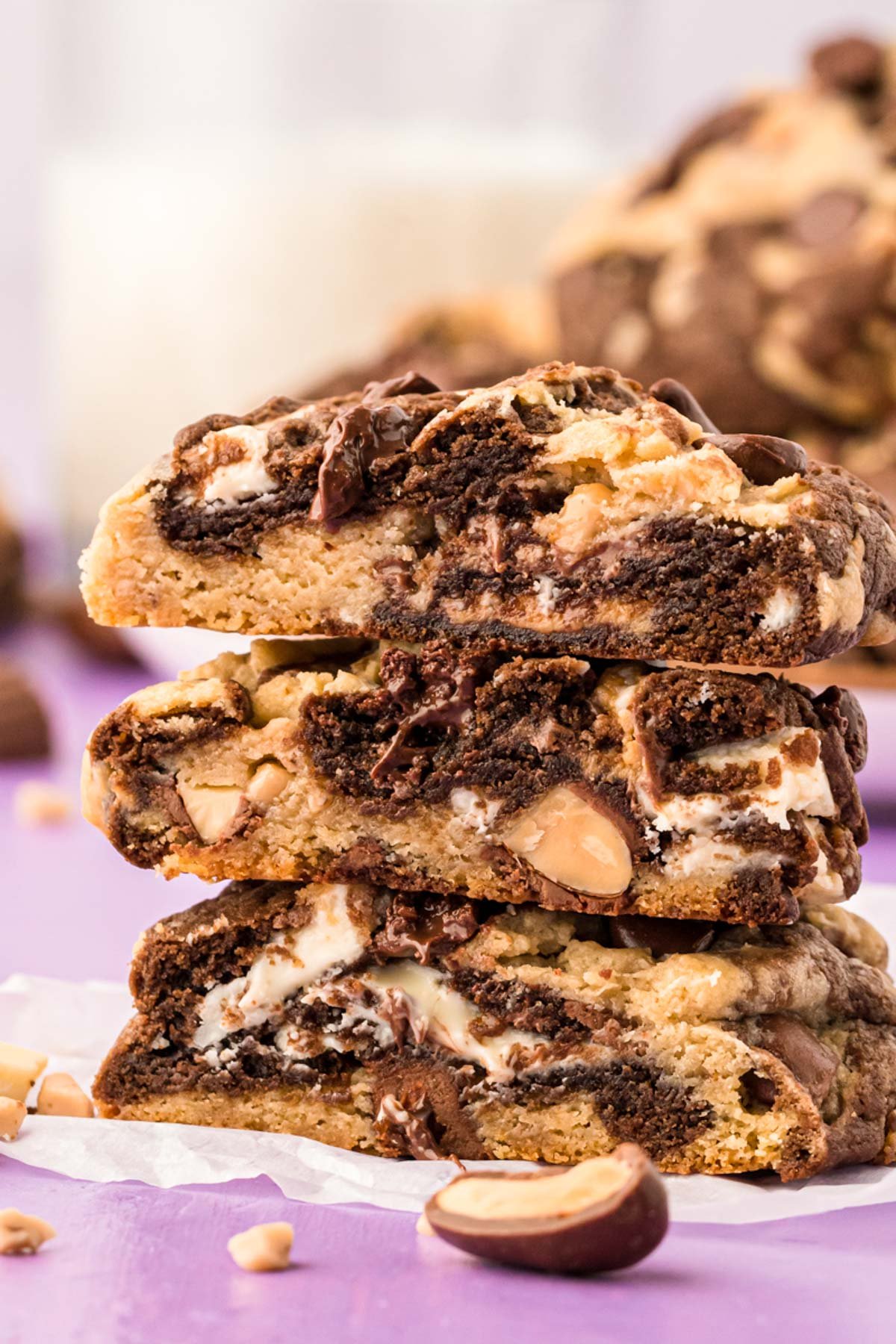 A stack of three kitchen sink cookies that have been cut in half.