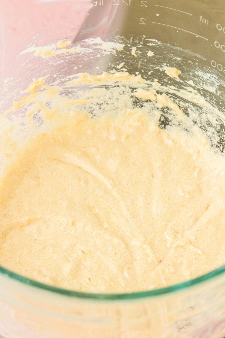 Cake batter in a glass mixing bowl.