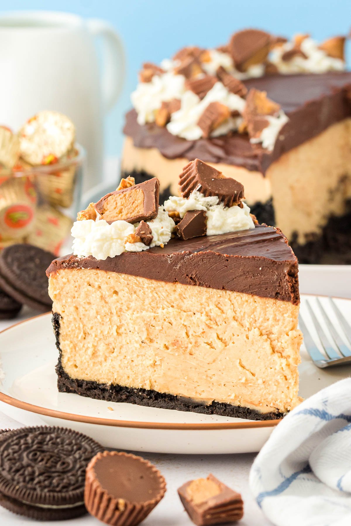 A slice of peanut butter cheesecake on a plate.