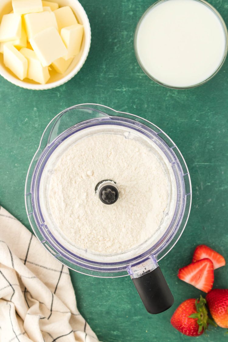 Flour and sugar in a food processor.