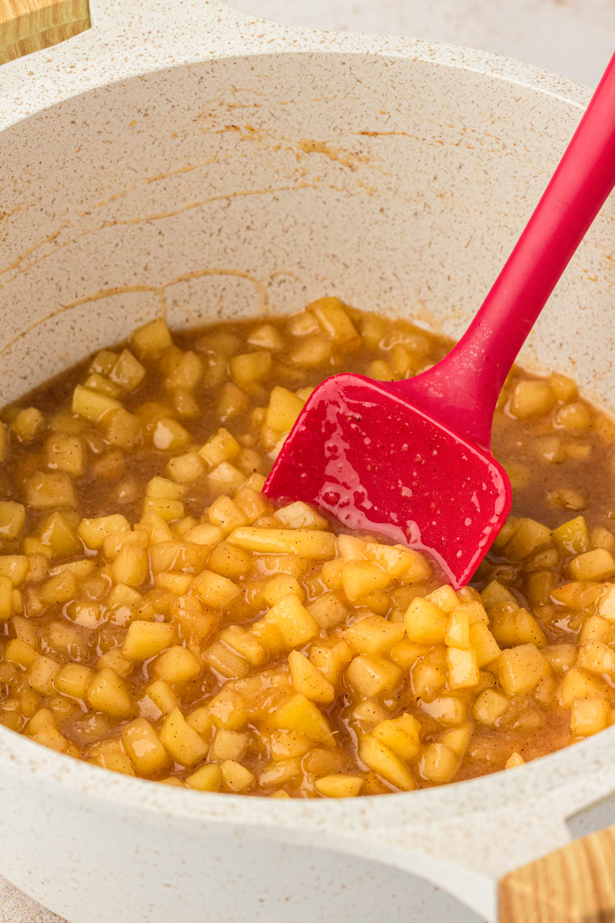 Apple pie filling for cookies in a saucepan.