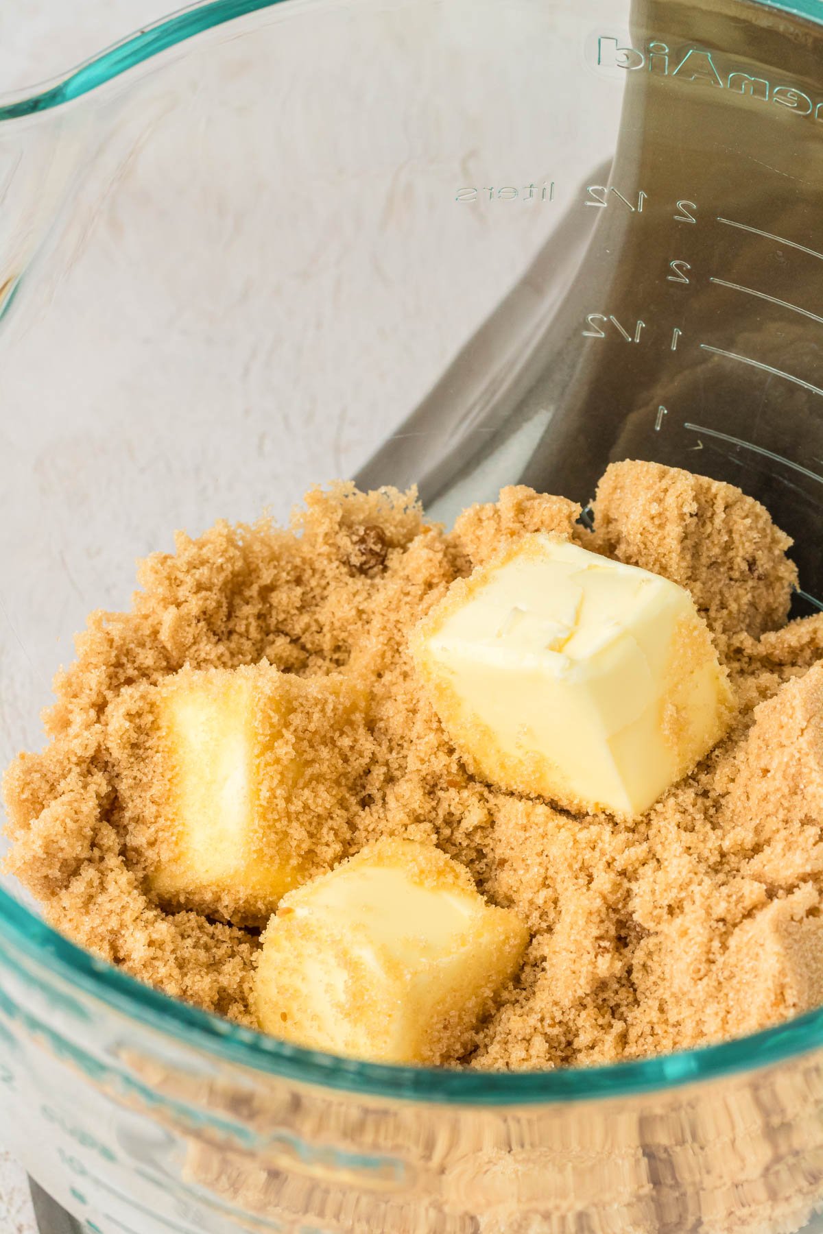 Butter and brown sugar in a mixing bowl ready to mix.