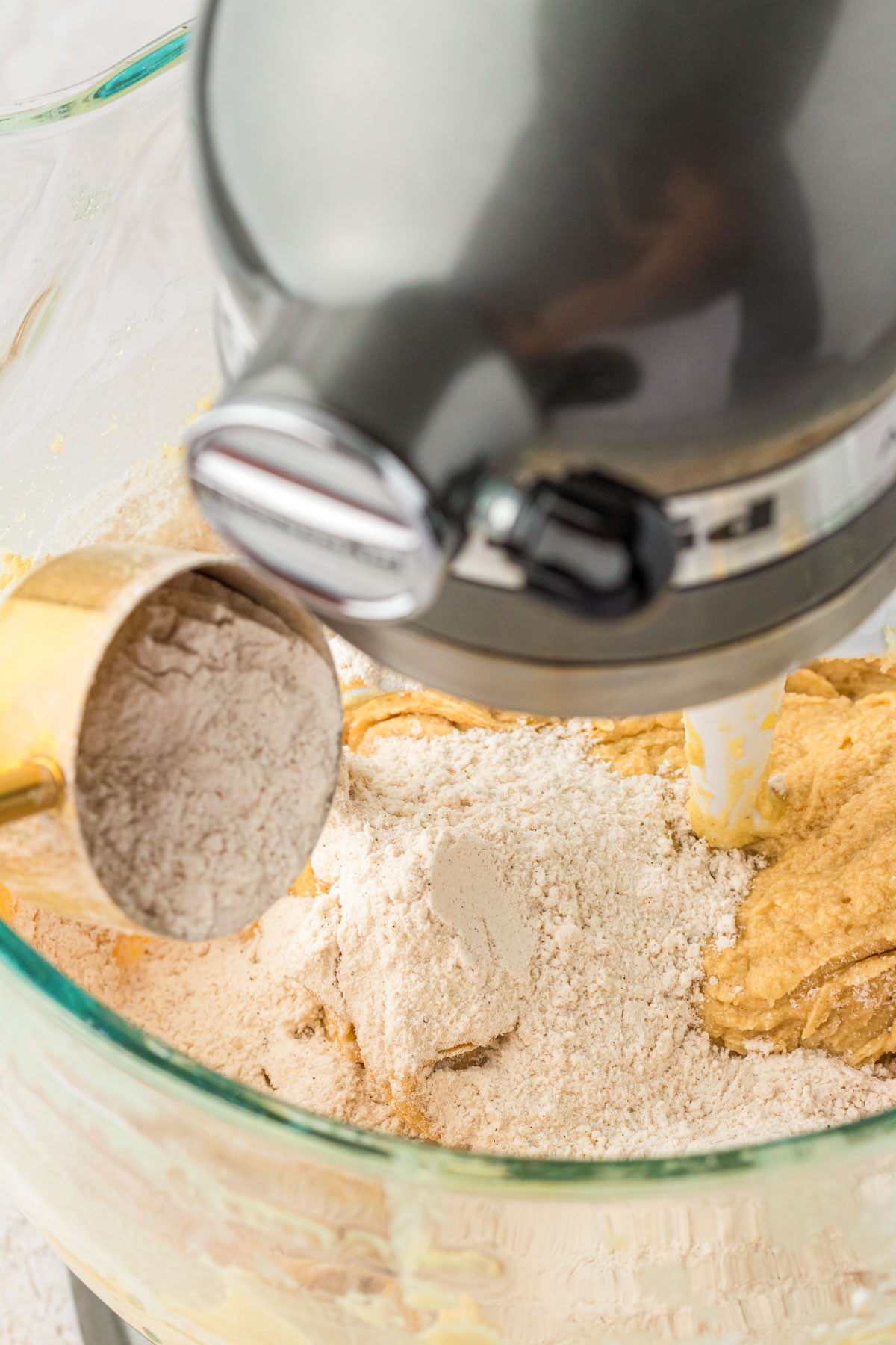 Dry ingredients being added to wet ingredients.