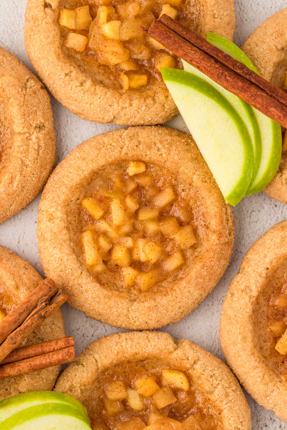 Overhead photo of apple pie cookies on a counter.