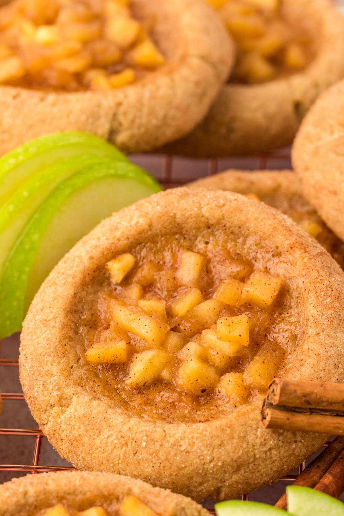 Close up of apple pie cookies on a wire rack. 