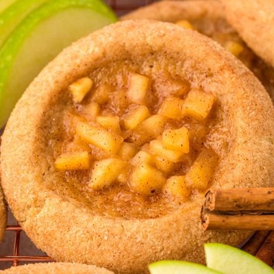 Apple pie cookies on a wire rack.