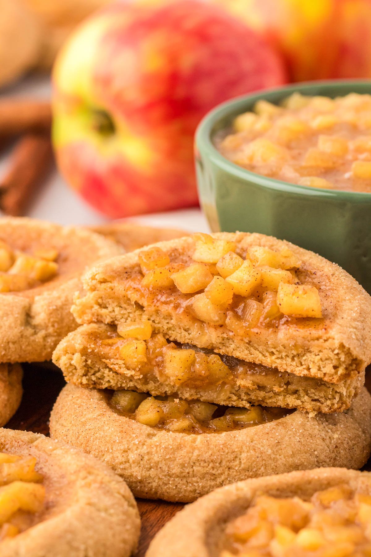 Apple pie cookies stacked.